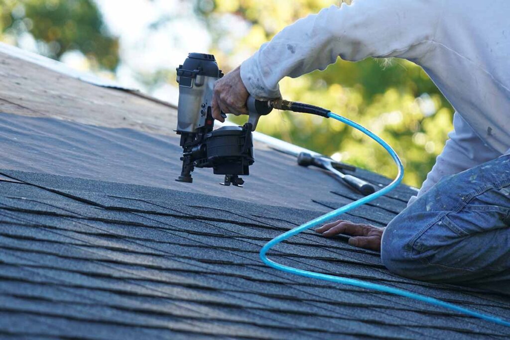 "Professional roof repair service on a residential home in the Twin Cities"