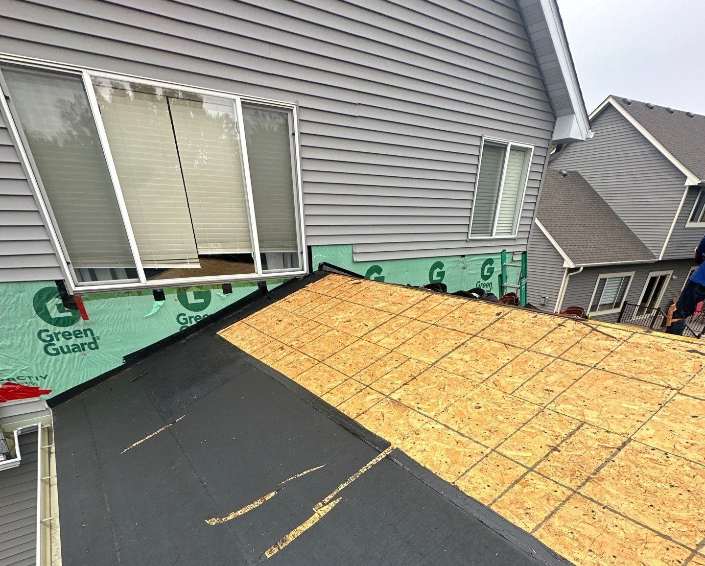 "Professional roof repair service on a residential home in the Twin Cities"