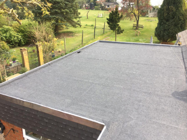 "Flat roof maintenance and repair on a commercial property"