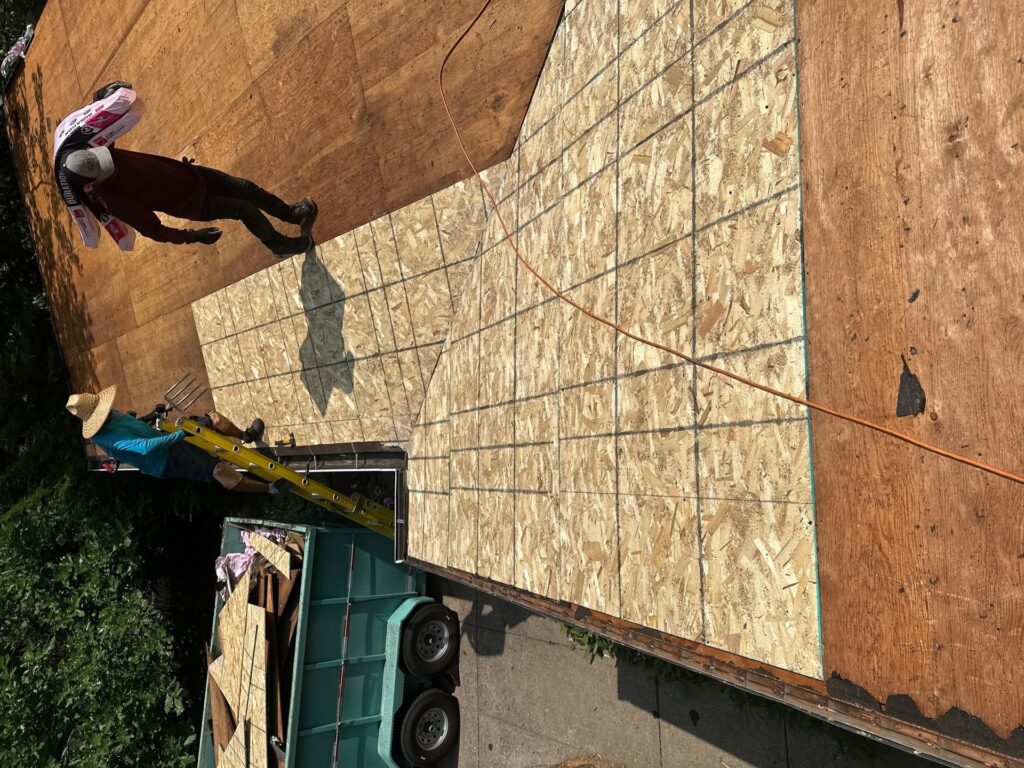 "Professional roof repair service on a residential home in the Twin Cities"