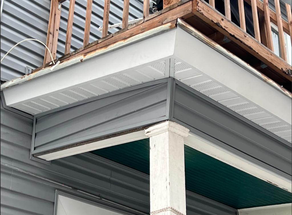 "Soffit installation under roof eaves for improved ventilation"